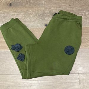 Rare Nike olive patchwork sweatpants with zipper pockets .
